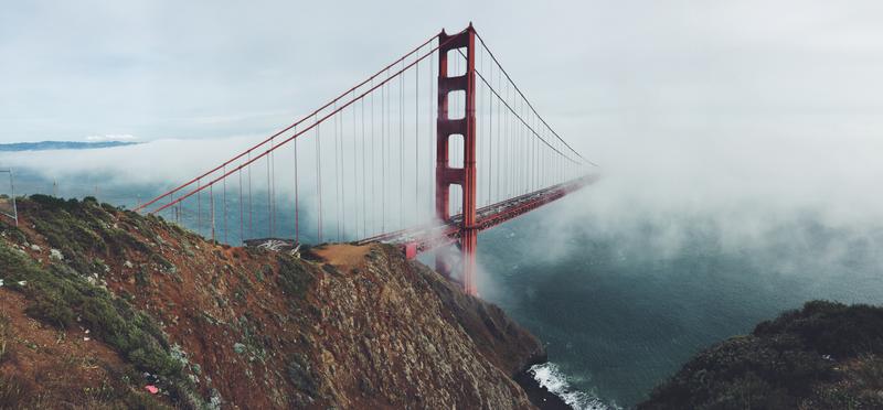 [The Golden Gate Bridge in the fog. Public domain photo.]